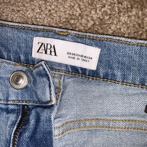 Distressed mid-rise jeans